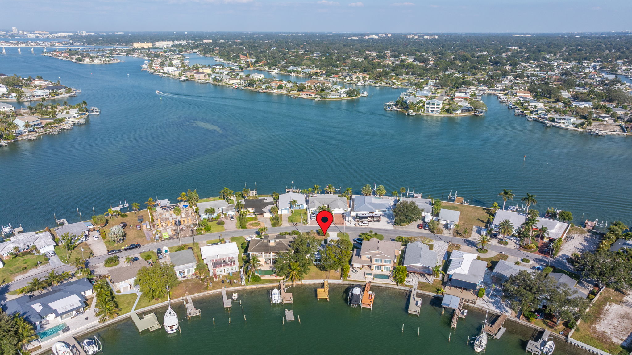 Aerial view of Indian Rocks Beach Intracoastal bay showing waterfront STR investment neighborhood with private docks boats and waterway access in Pinellas County Florida