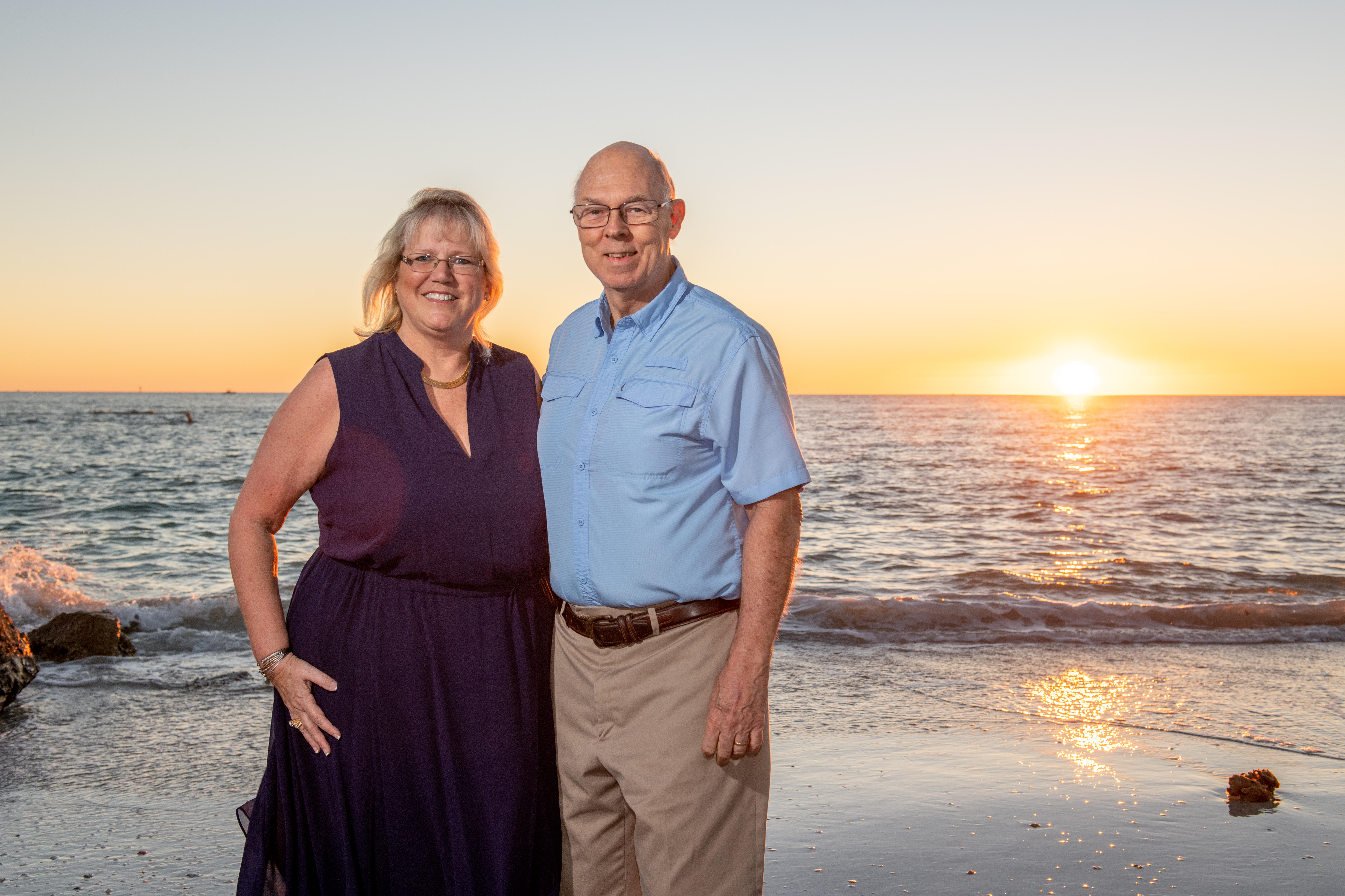 Cyndee and Jack Haydon on Madeira Beach at sunset - Sandbars to Sunsets Team Future Home Realty Madeira Beach waterfront property owners and STR investment specialists Pinellas County Florida