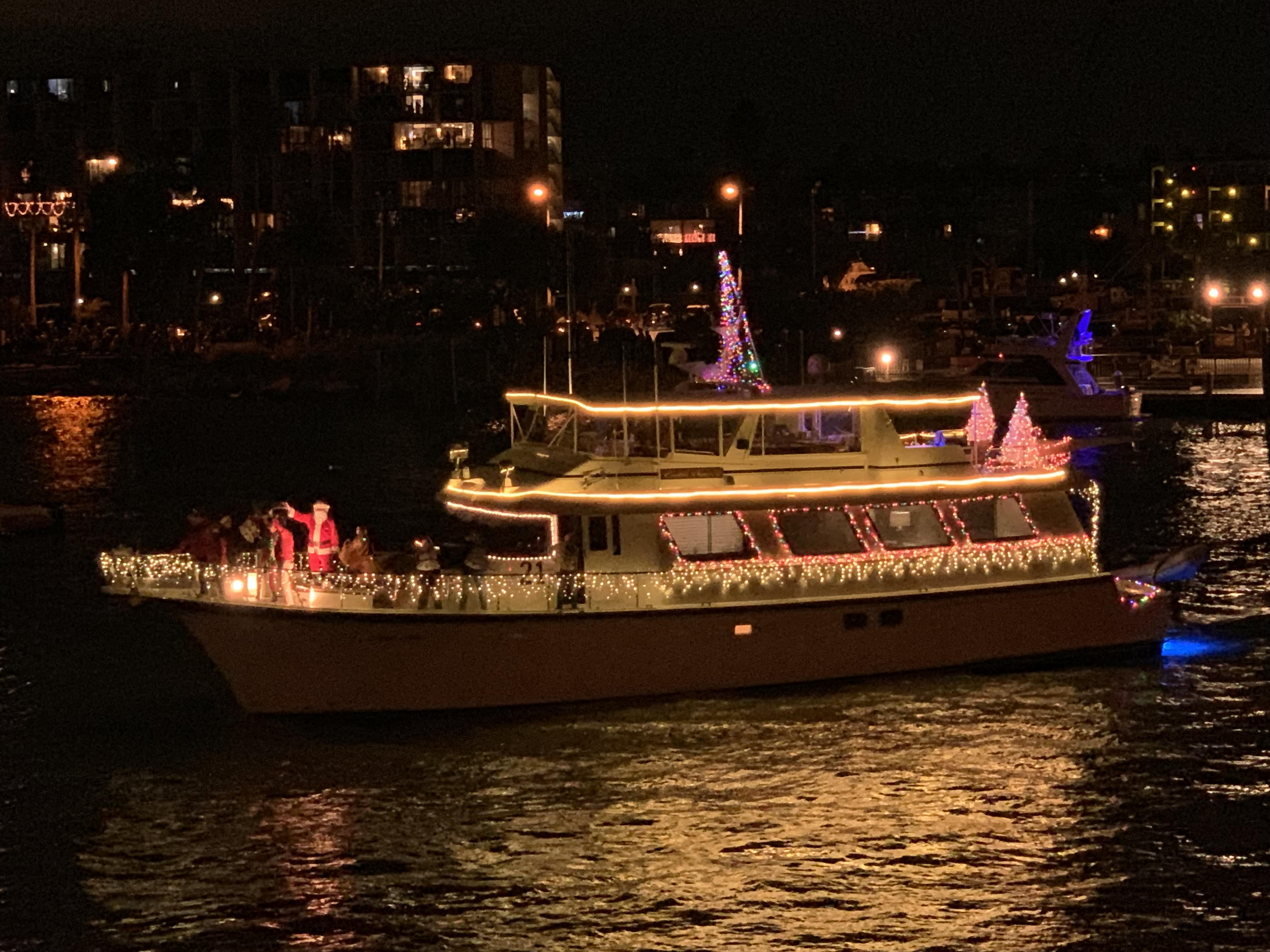 Madeira Beach Festival of Lights Holiday Boat Parade decorated yacht with Christmas lights and Santa Claus on Boca Ciega Bay December annual event Pinellas County Florida