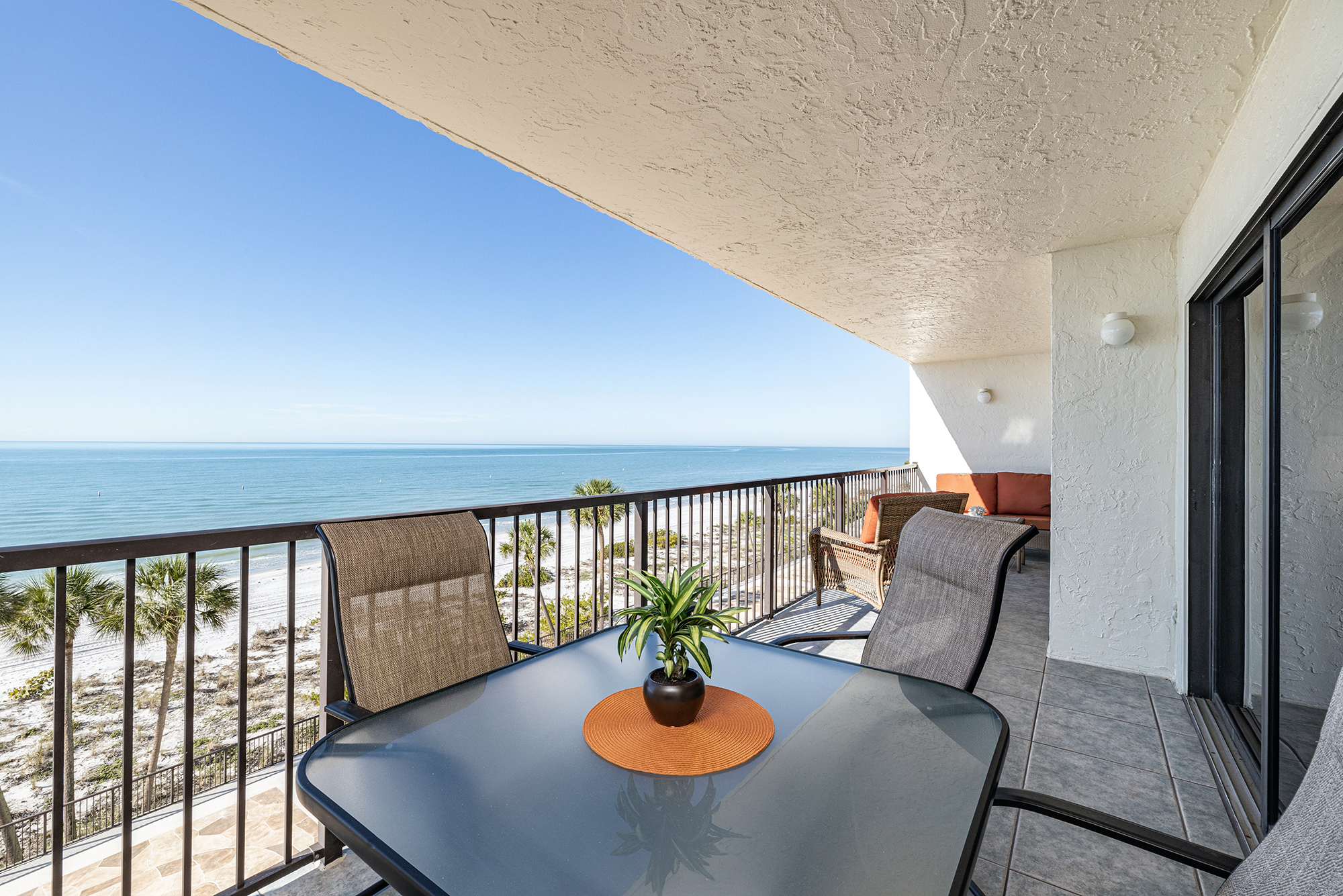 Gulf front vacation rental condo balcony beach view Madeira Beach Florida STR investment property Pinellas County