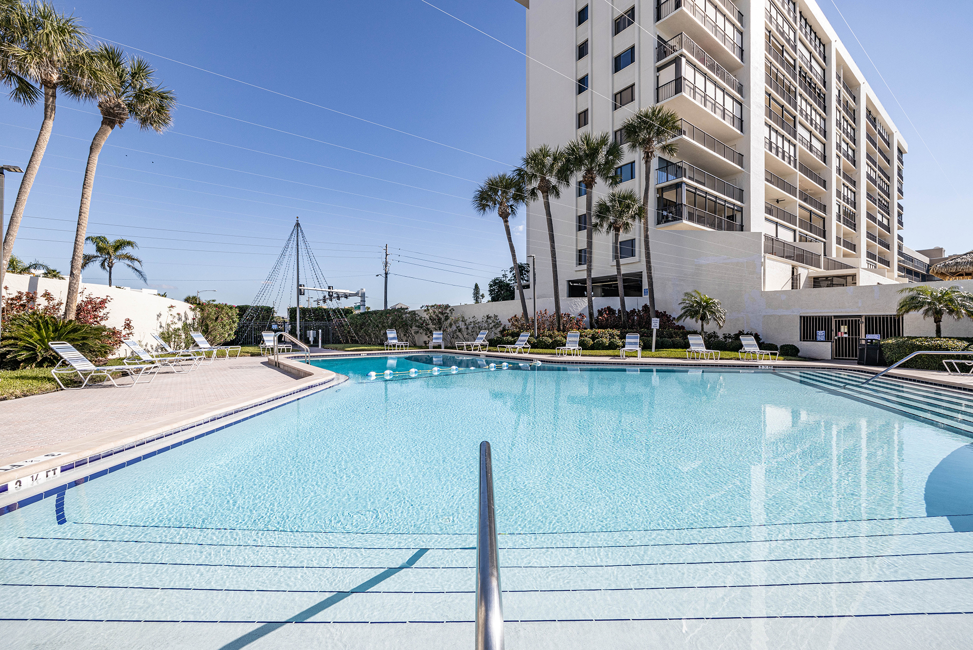 Ocean Sands Gulf front condominium tower with pool at 14950 Gulf Boulevard Madeira Beach Florida - STR eligible vacation rental condo building Pinellas County